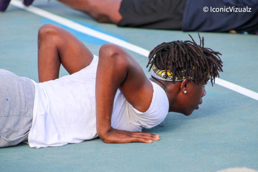 Manchester Basketball student exercising on the tennis court